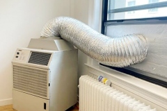 Another view of a Portable Air Conditioner with a window vent