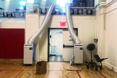 2 Temporary Air Conditioners and cooling fans in a gymnasium