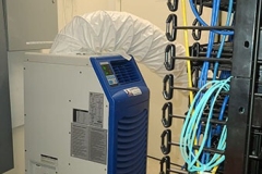 Portable AC unit used in a server room.